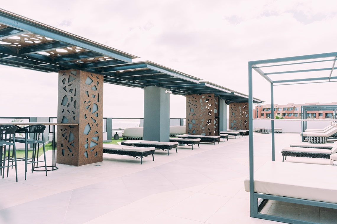 Rooftop lounge at 001 Higos Beach | 001 Hotels for ultimate relaxation.