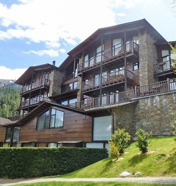 a large building with a lot of windows and balconies