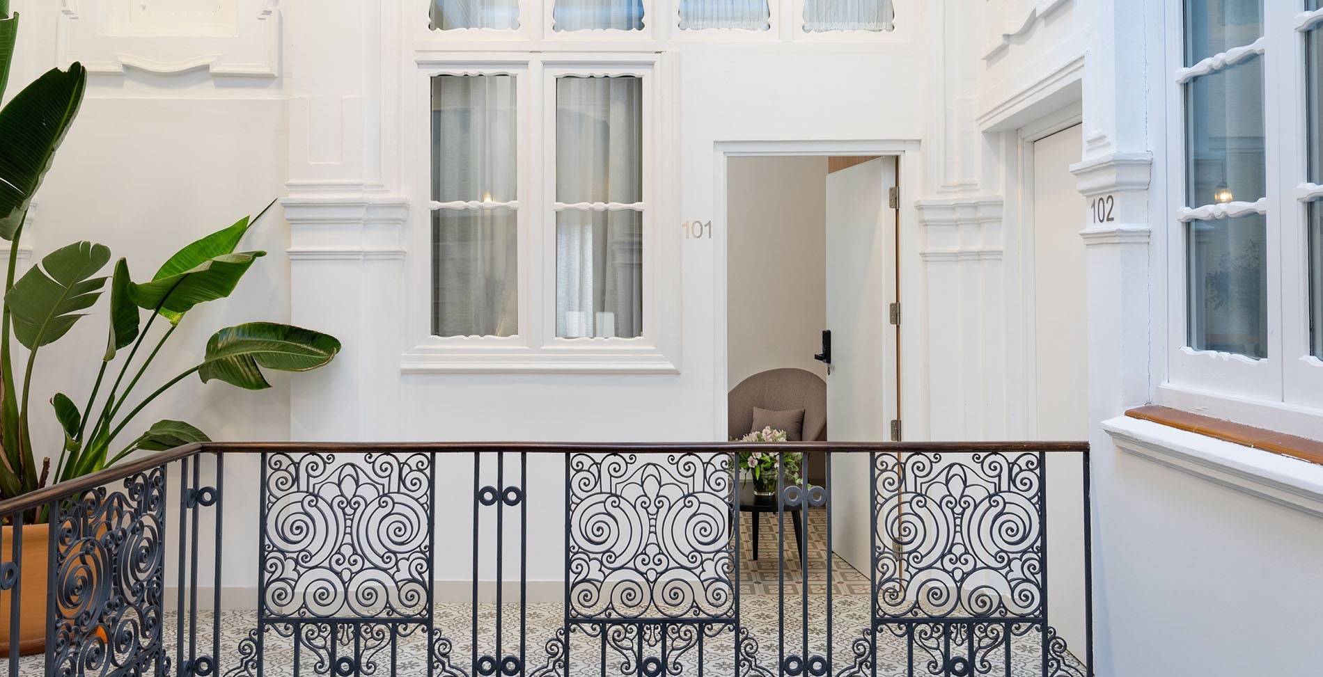 a balcony with the number 101 on the wall