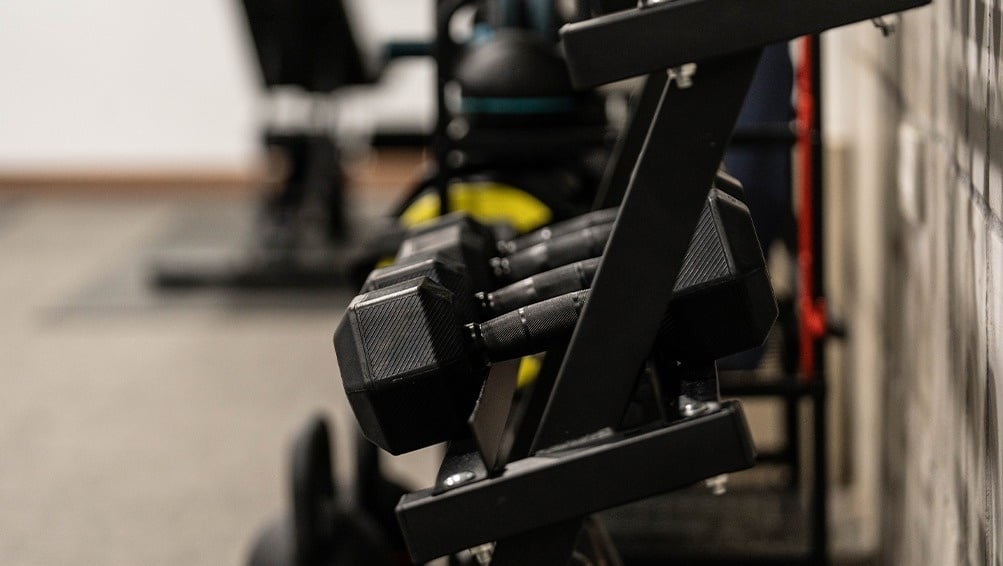 a row of dumbbells are stacked on top of each other