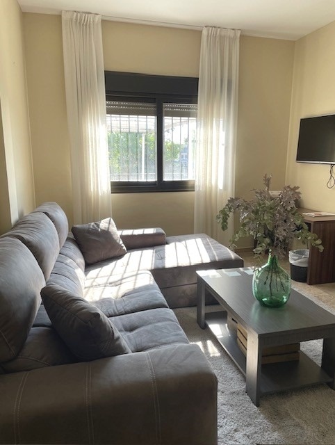 a living room with a couch and a coffee table