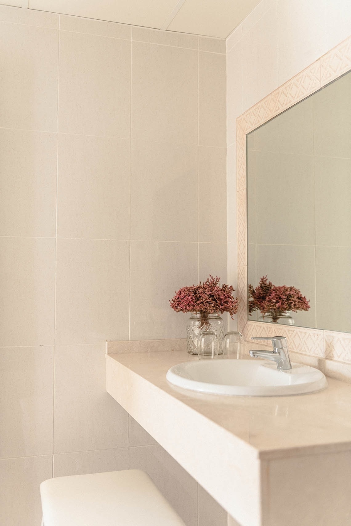 a bathroom counter with a sink and a mirror