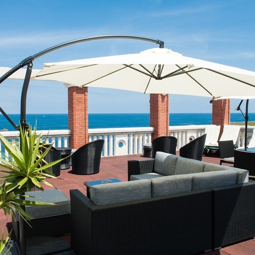 Torre Cristina terrace with sea views and outdoor furniture.