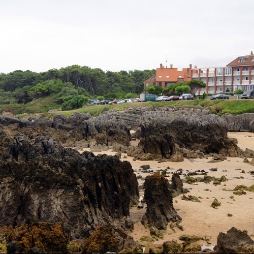 Hotel Torre Cristina: sea views with rocks, beach and buildings.