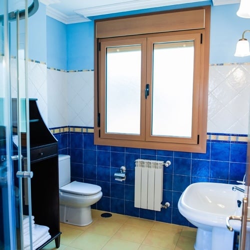 Modern bathroom with bidet and window at Torre Cristina.