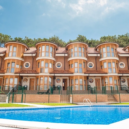 Modern apartments with pool and pine views at Torre Cristina.