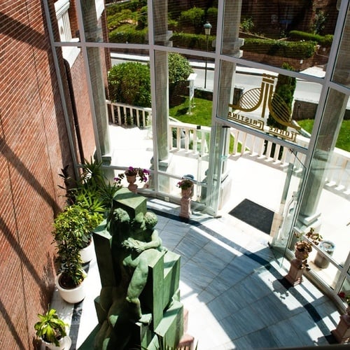 Interior staircase and sculpture at Torre Cristina, overlooking the garden.