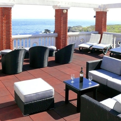 Torre Cristina terrace with ocean views and comfortable outdoor seating.