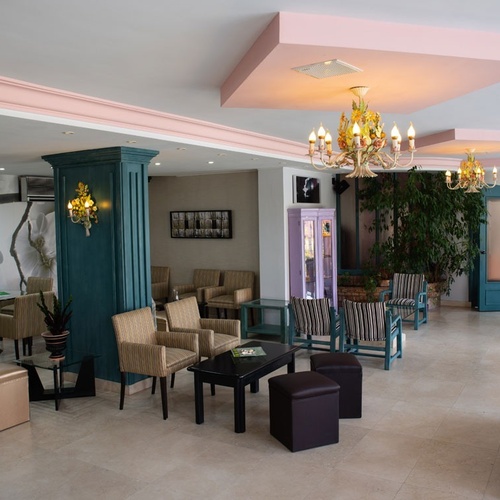 Luxurious lounge at Torre Cristina Hotel with plush seating and elegant decor.