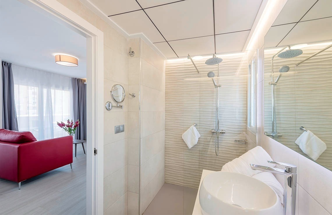 a bathroom with a sink and a walk in shower