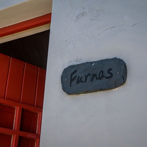 a sign on a wall that says furnas on it