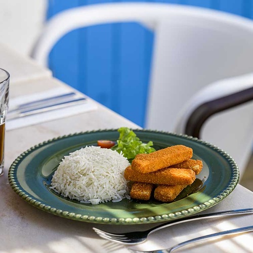 Aldeia da Pedralva restaurant's fish fingers with rice and salad.