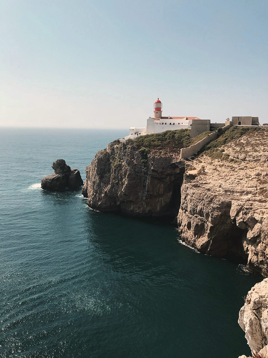 Coastal lighthouse and fortress on cliffs overlooking the ocean Aldeia da Pedralva