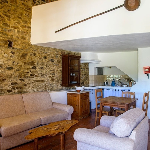 a living room with a couch a chair and a table