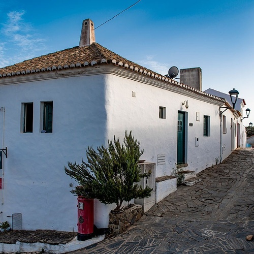 a white building with a sign that says ' coca cola ' on it