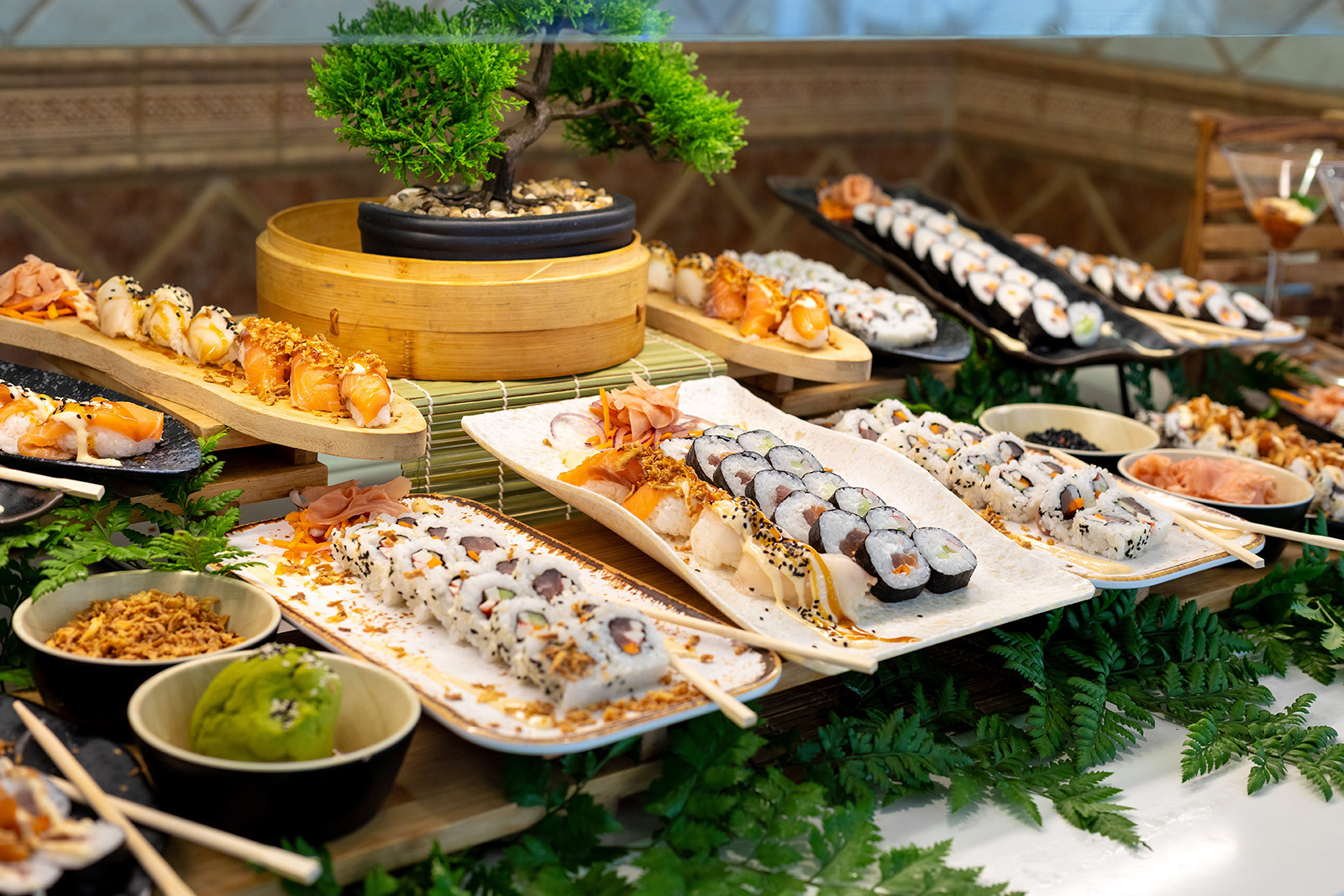 Spacious Alexandre Corporativa hotel buffet restaurant with numerous set tables and food stations.