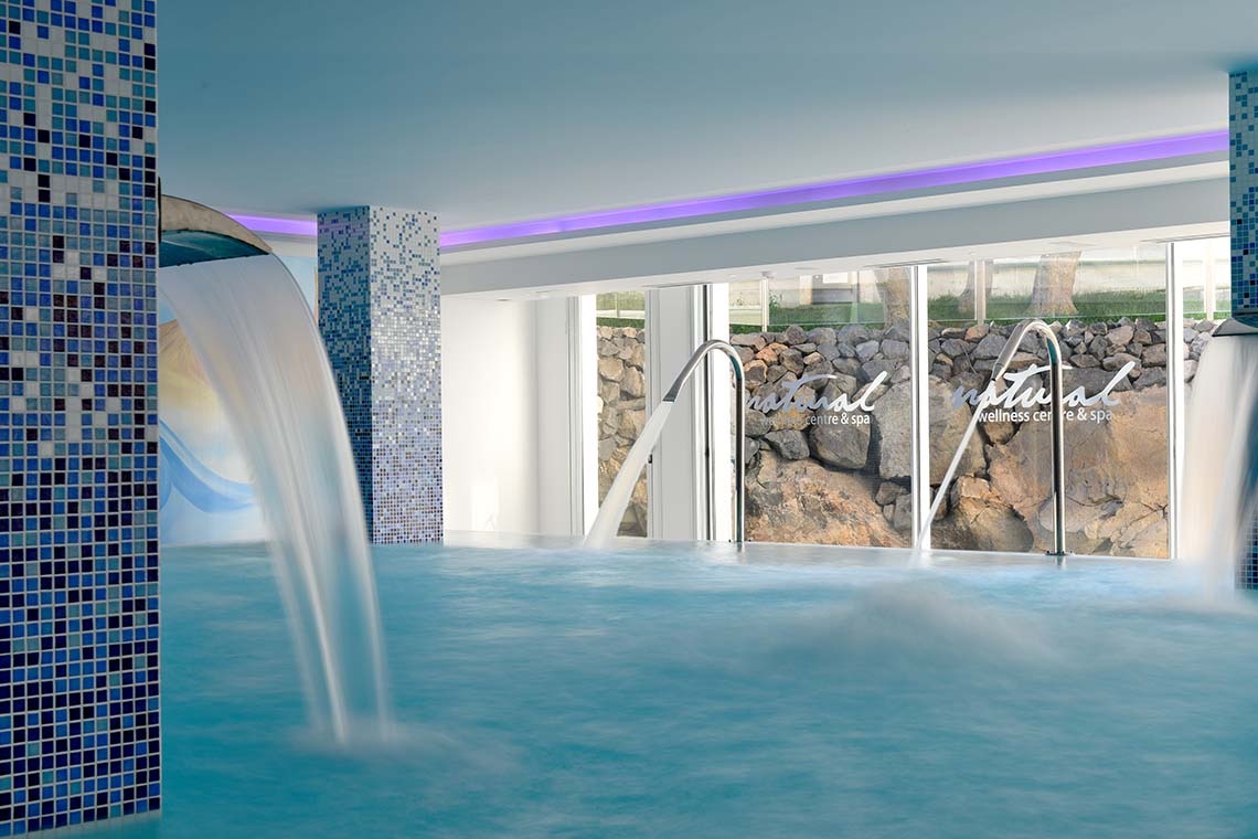 Indoor pool with waterfalls at Alexandre Troya, a 4-star hotel in Playa de las Américas.