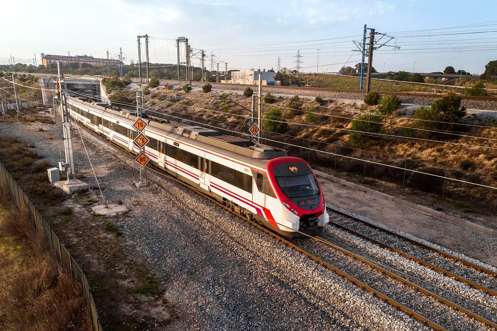 Modern red and white train by Los Boliches Station, near Hotel Angela, Fuengirola, Malaga.