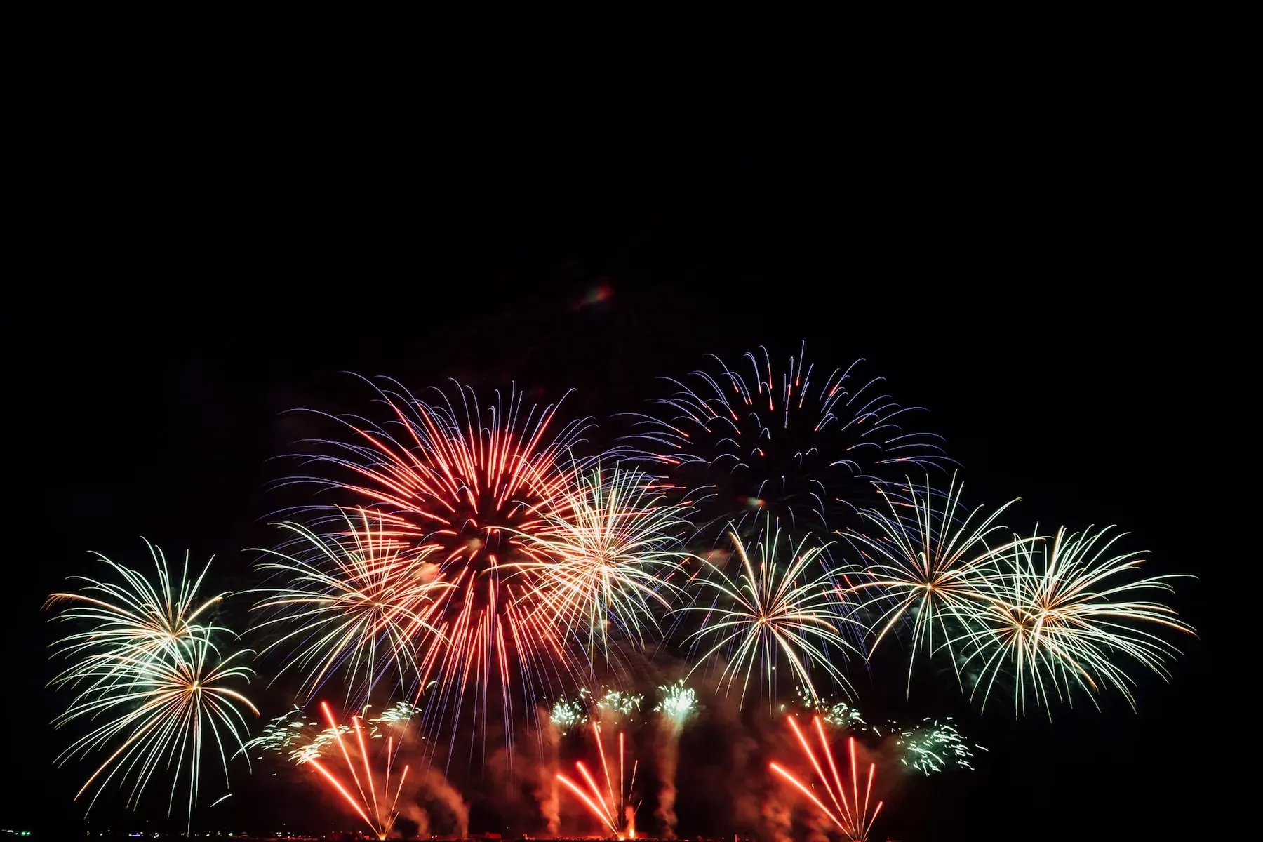 Angela's Hotel: Vibrant fireworks display over the night skyline.