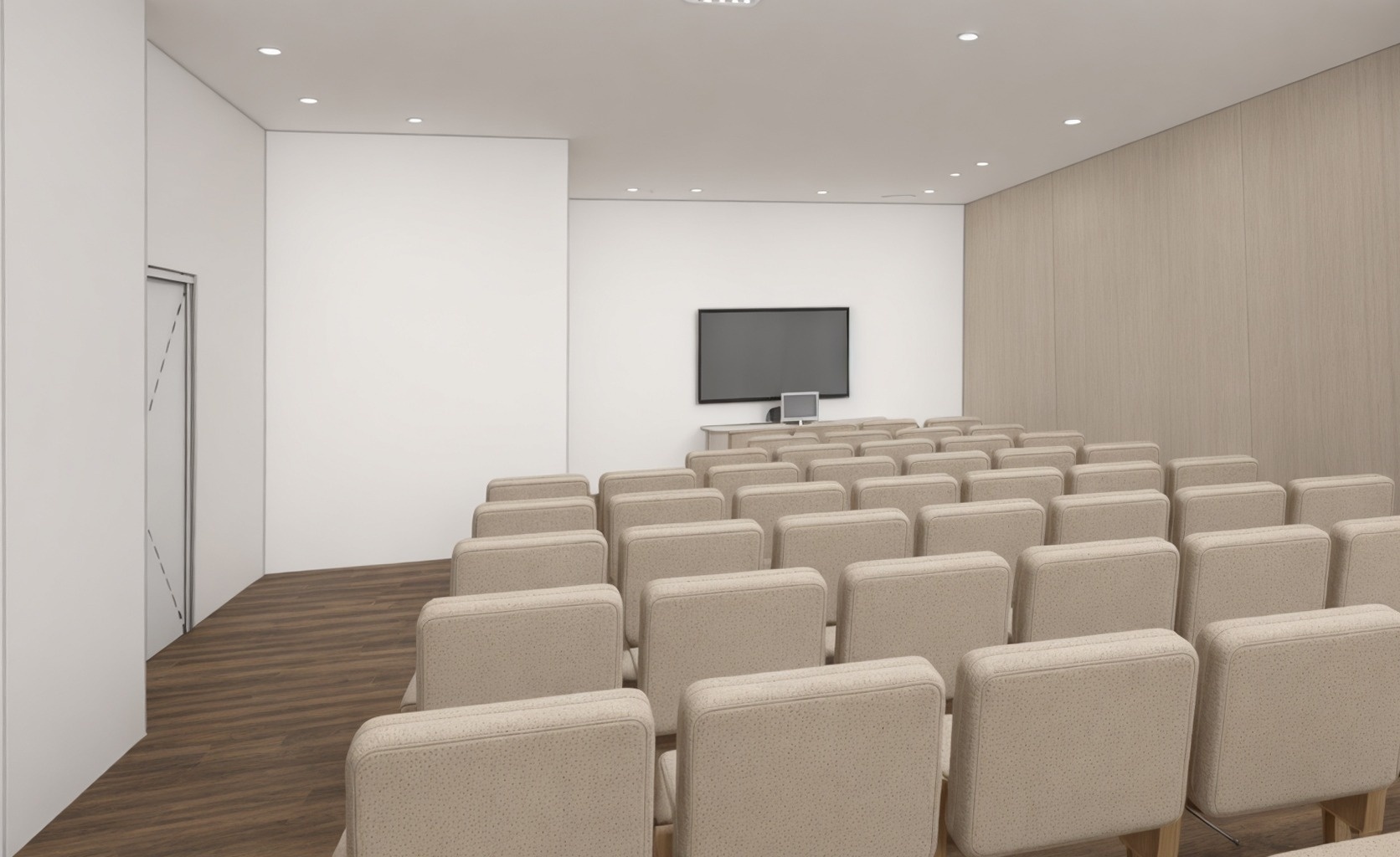 una sala de conferencias con sillas y una televisión en la pared