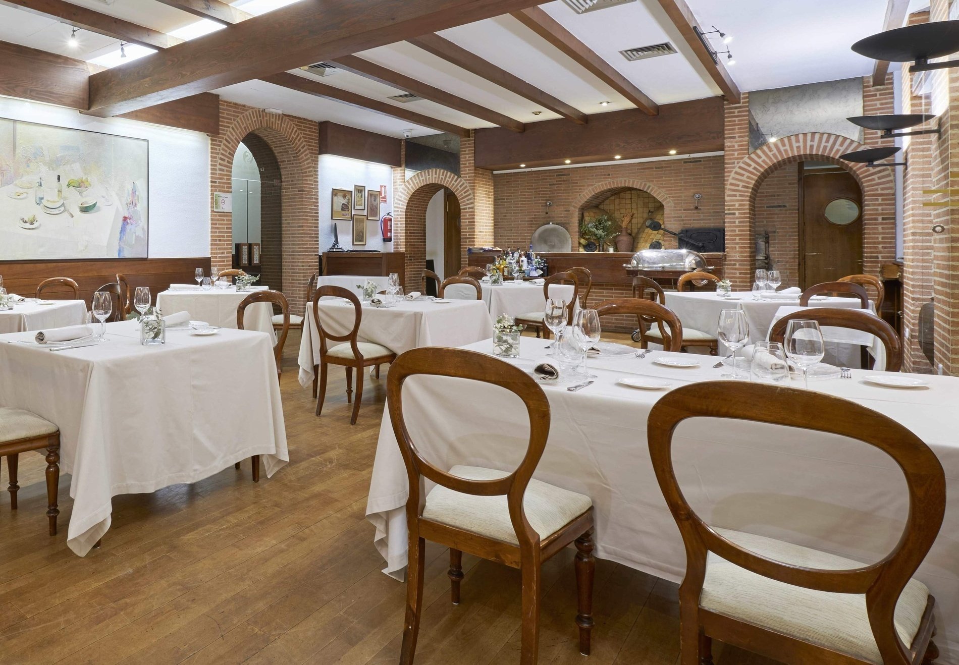 a bottle of wine sits on a table in a restaurant