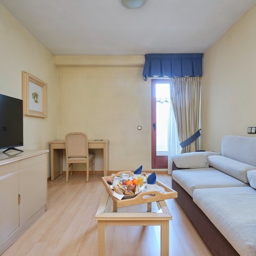 a living room with a couch and a flat screen tv