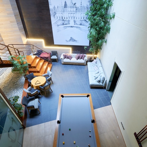 an aerial view of a living room with a pool table