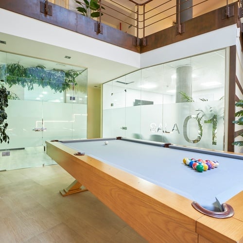 a pool table in a room with the number 01 on the wall