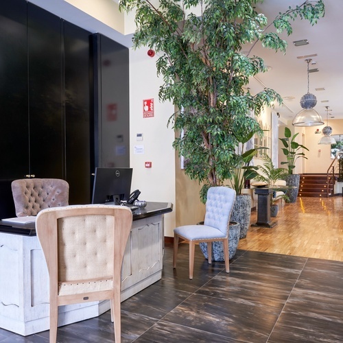 a desk with a dell computer on it in a lobby