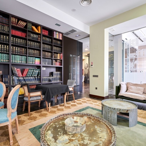 a living room with a table and chairs and a couch