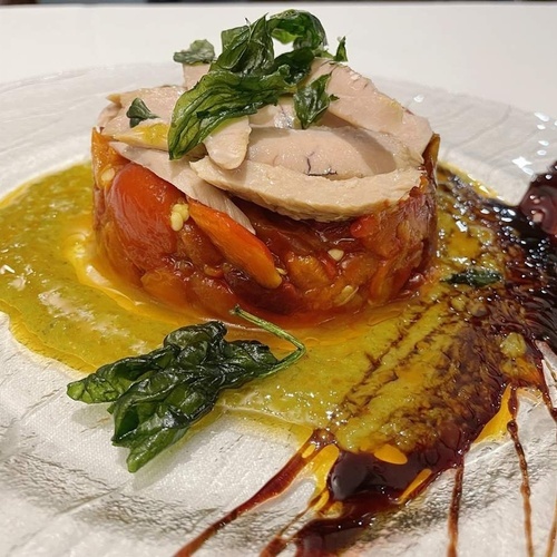 a close up of a plate of food with sauce on it