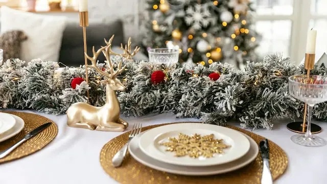 a place setting with a pine cone on a plate