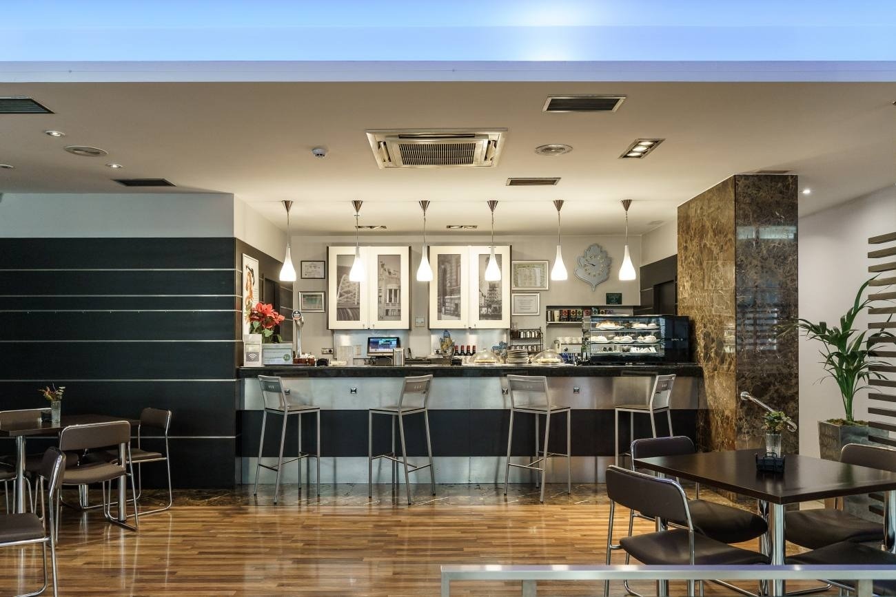 a restaurant with tables and chairs and a bar