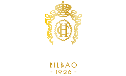 a black and gold logo for hotel carlton bilbao 1926