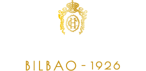 a black and gold logo for hotel carlton bilbao 1926