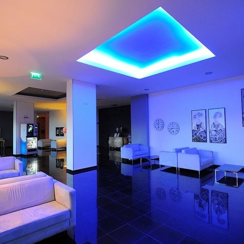 a room with a blue light on the ceiling