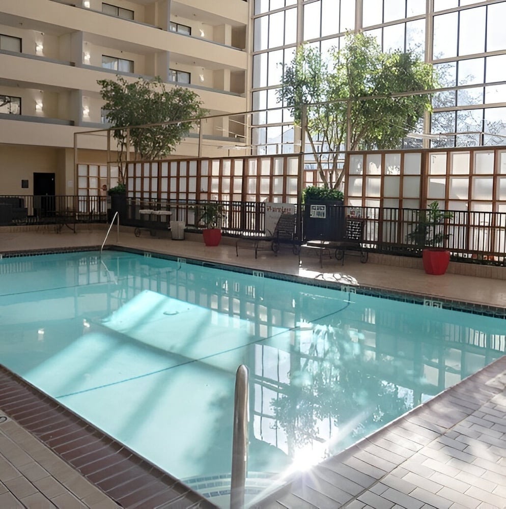 an indoor swimming pool with a sign that says no diving