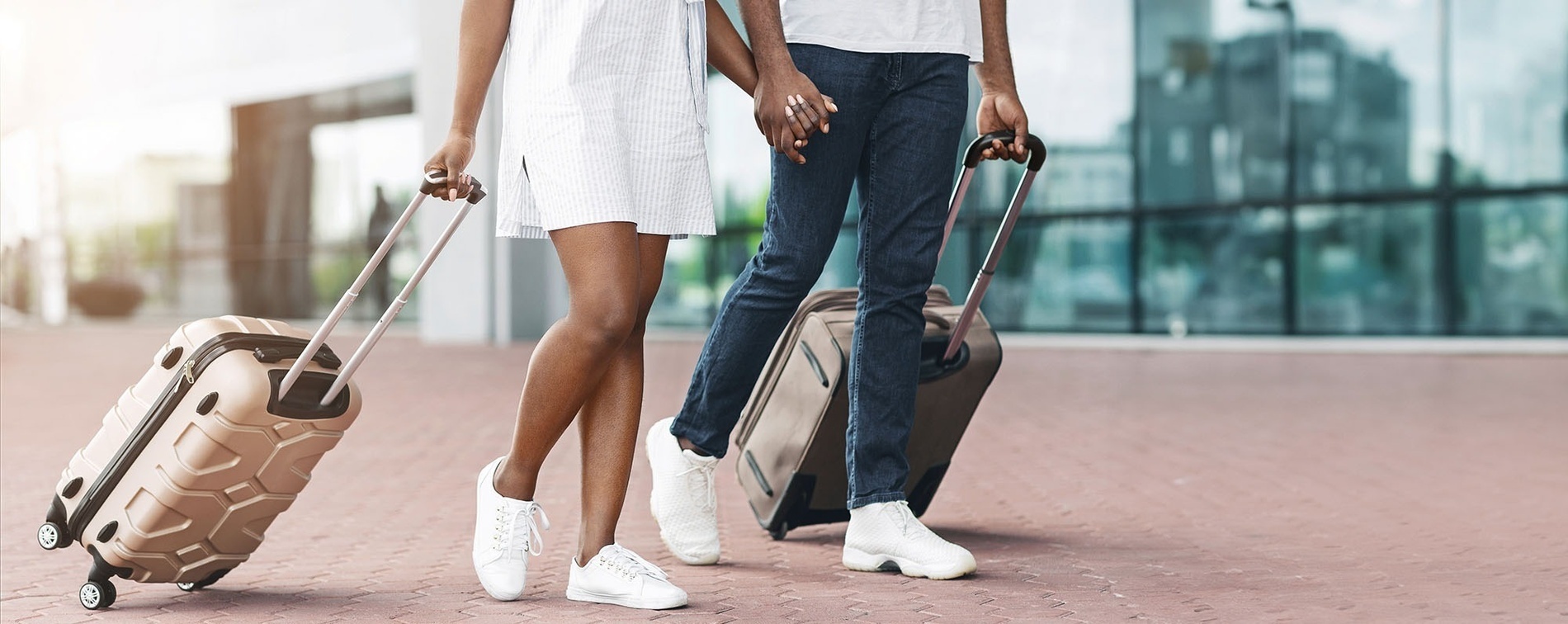 a woman sits at a table using a laptop computer