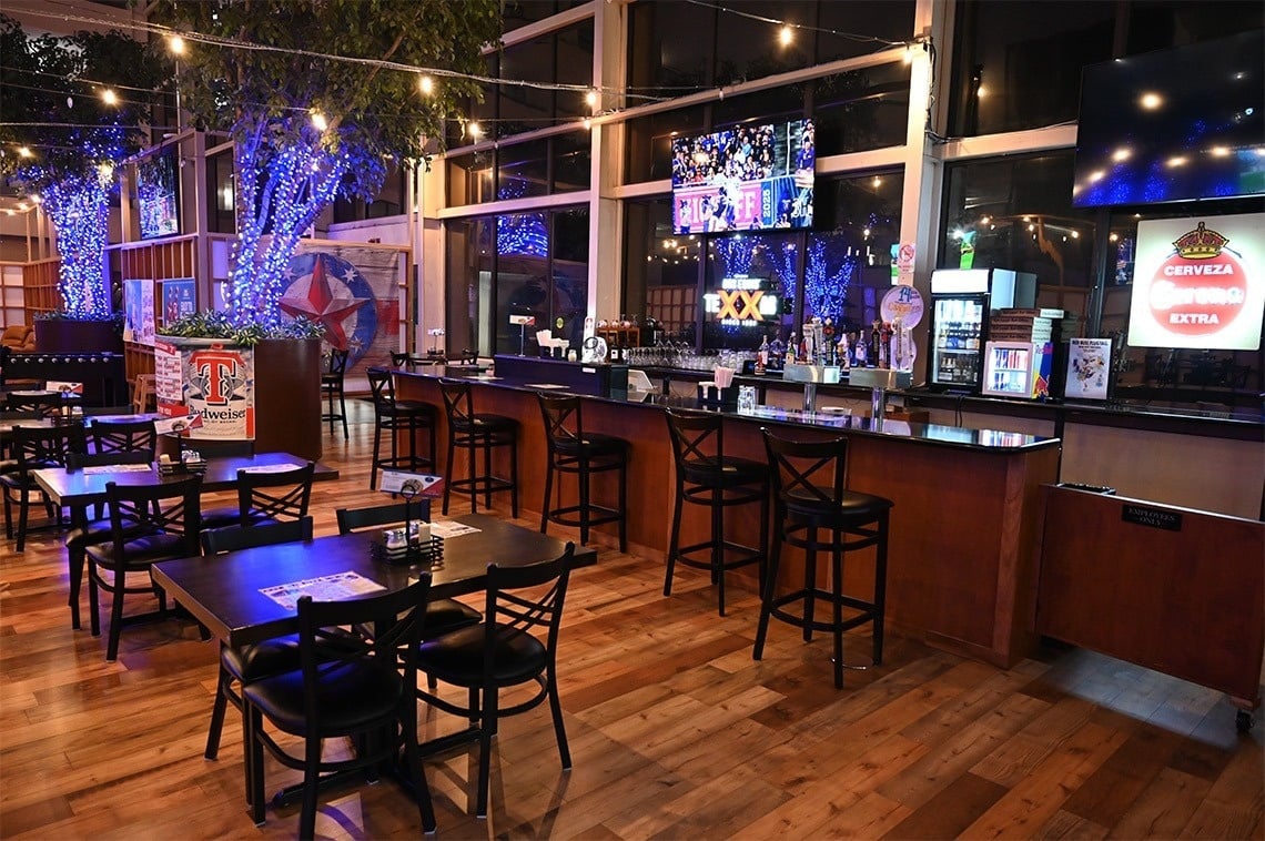 a bar with a sign that says cerveza extra on it