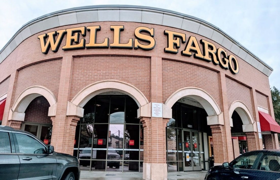 a hotel room with a king size bed and a chair