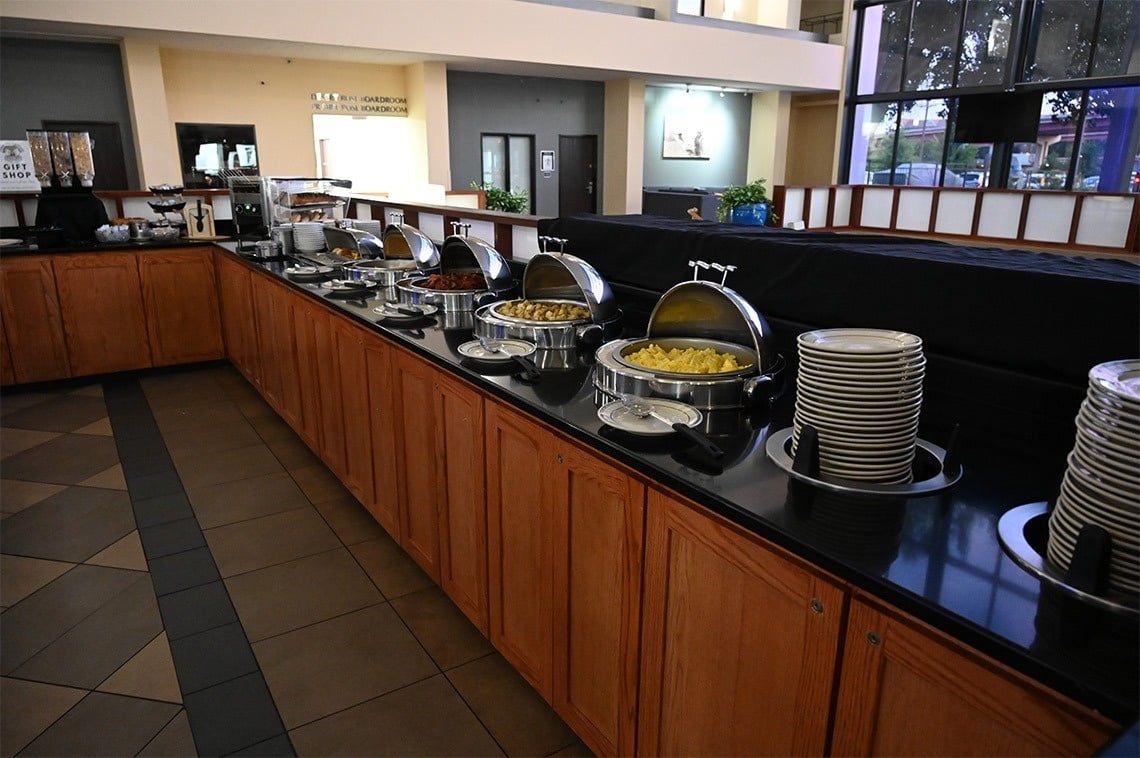 a buffet line in a restaurant with a sign that says coffee shop