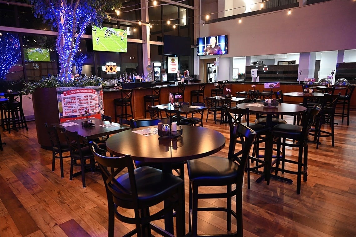 a restaurant with tables and chairs and a sign that says ' lucky premium rewards ' on it