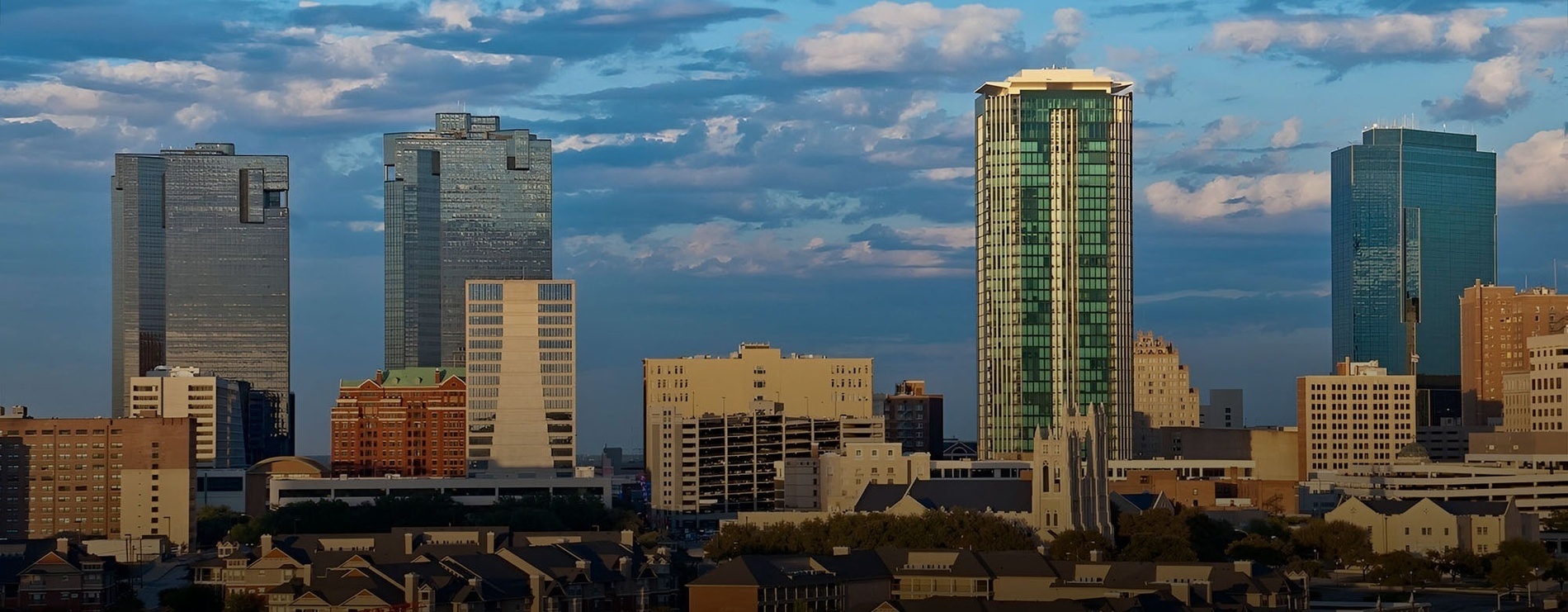 a city skyline with a church in the middle