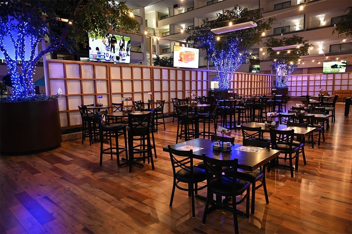 a restaurant with tables and chairs and a sign that says 10:45