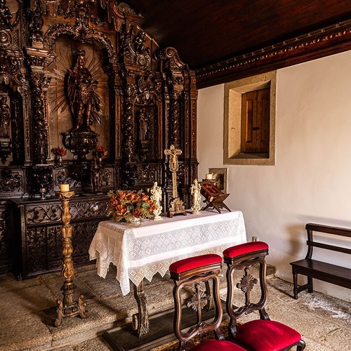a church with a statue of jesus on the altar