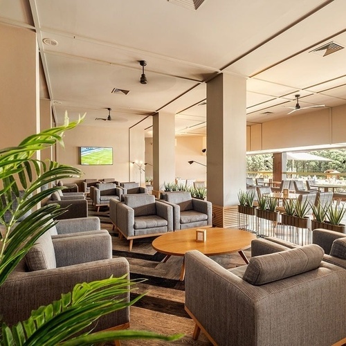 a large room with lots of chairs and tables