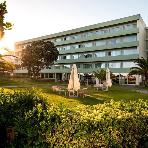 the sun is shining through the windows of a hotel