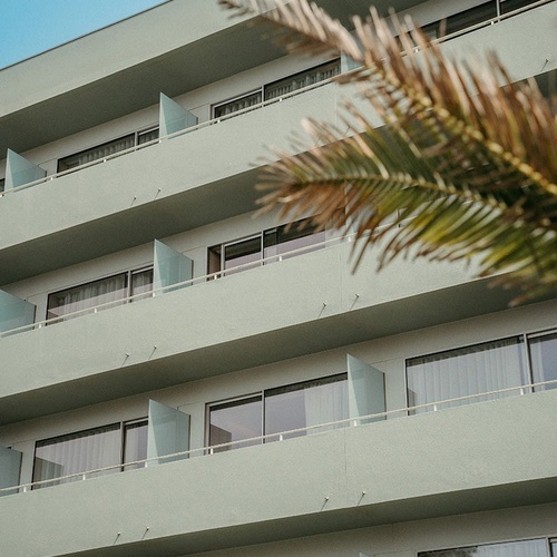 a building with a lot of windows and balconies