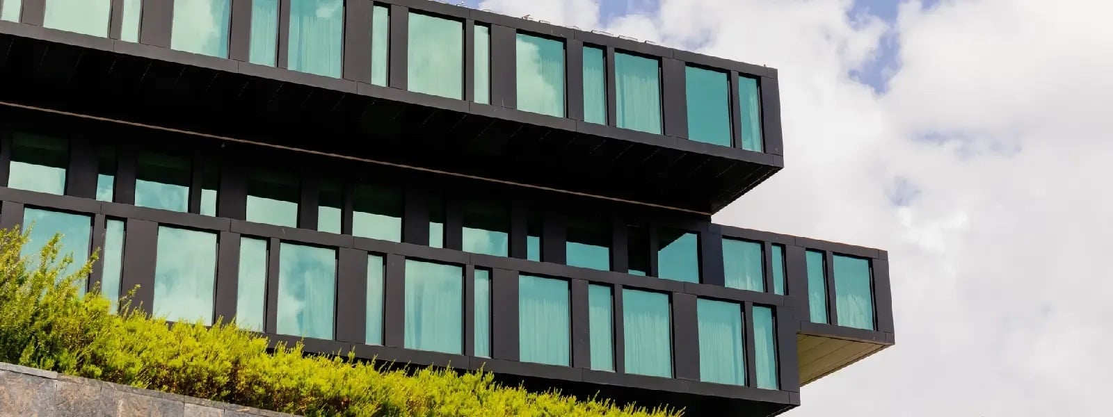 a large black building with lots of windows