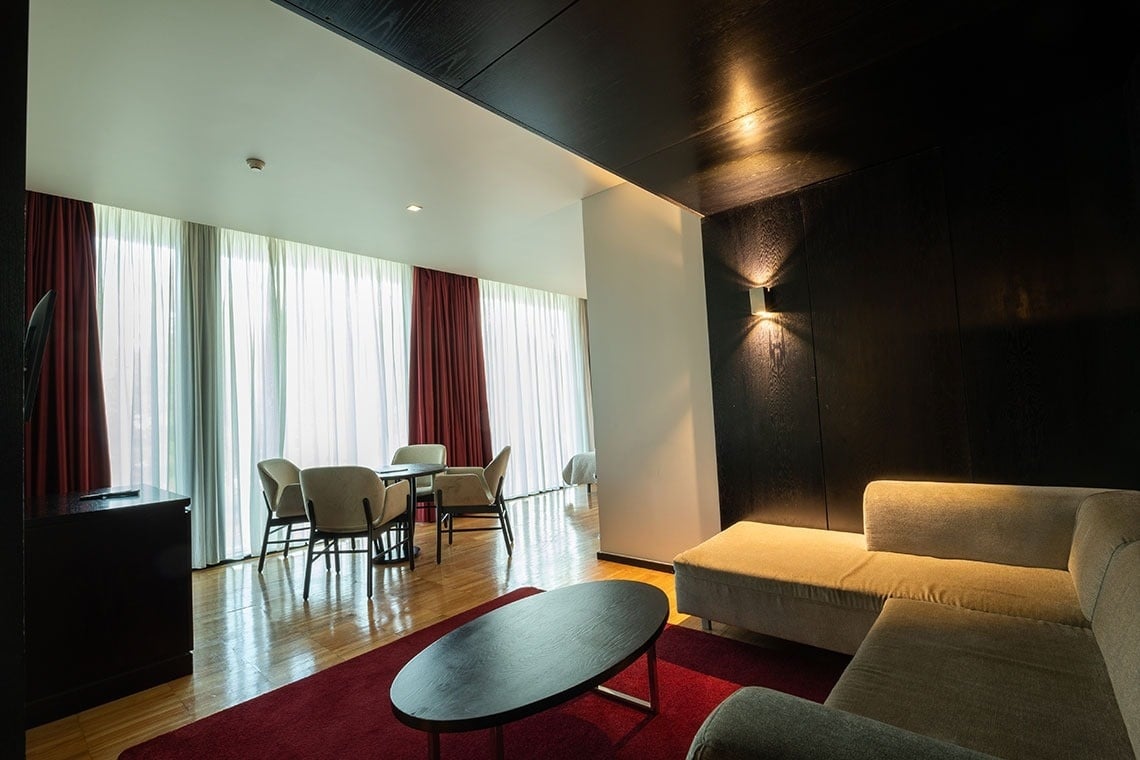 a living room with a couch a table and chairs